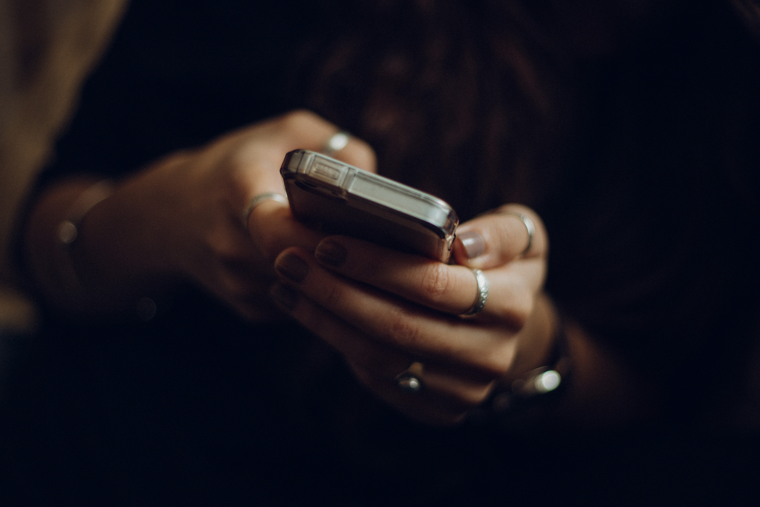 female hands holding a phone